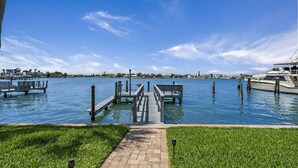 A marina with docks and a pathway leading to the water.