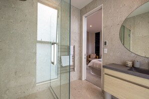 Shower, hair dryer, towels, soap