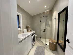 Shower, hair dryer, towels, soap