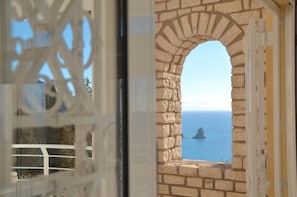 Enjoy unobstructed views of a serene body of water from the balcony.