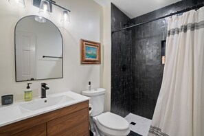 Hair dryer, towels, shampoo, toilet paper