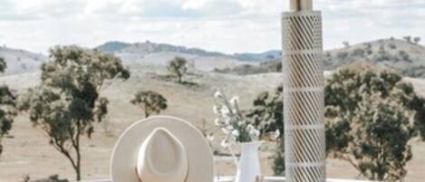 A hot tub with a view of a desert landscape.