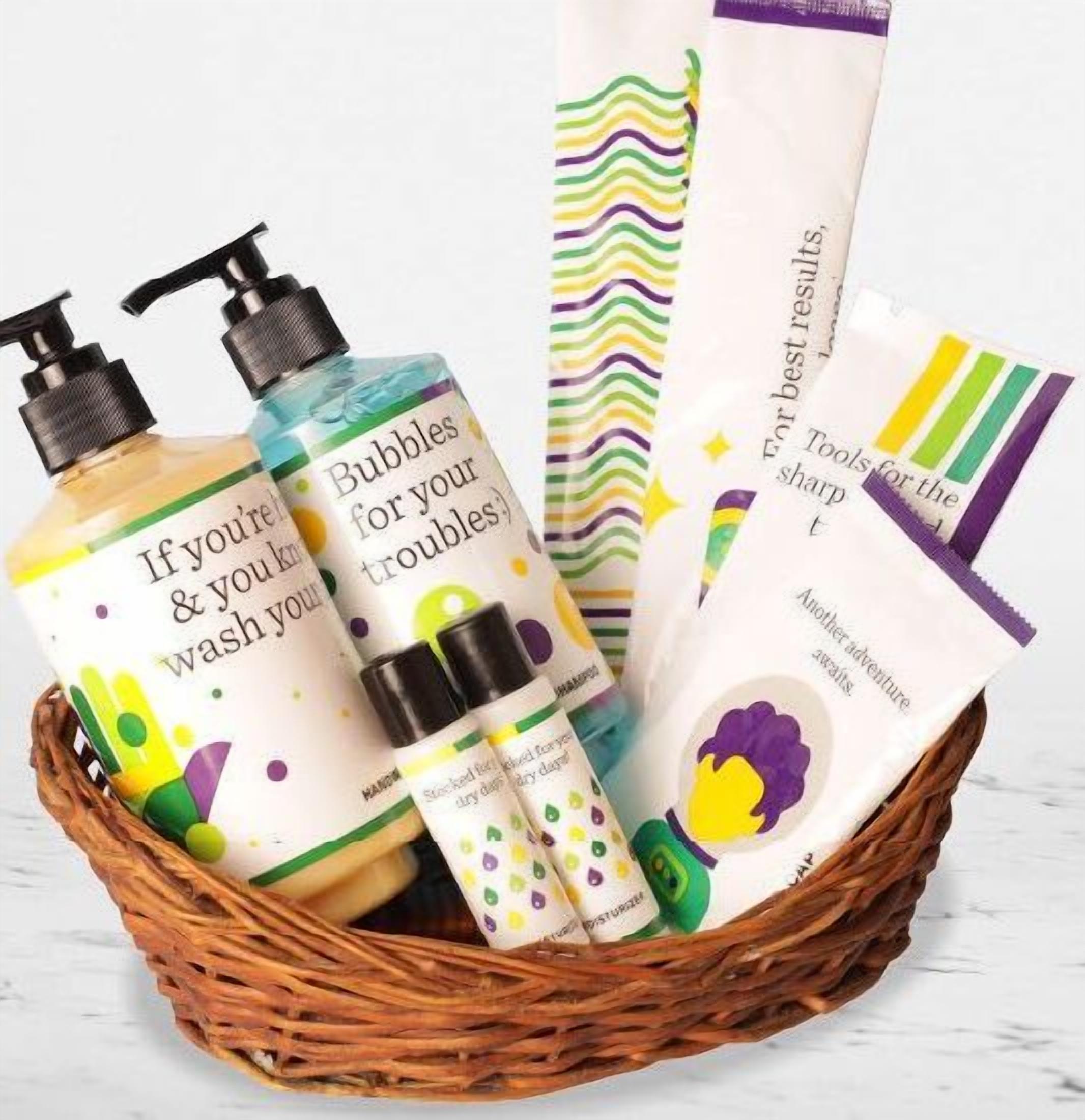 A basket containing various personal care items including bottles and bags with colorful designs and text.