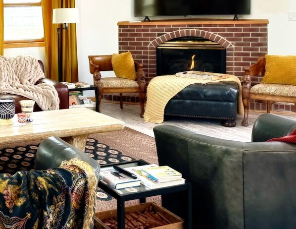 Smart TV, fireplace, table football, books