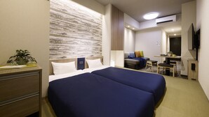 A hotel room with two beds, a desk, a chair, a small table, and a potted plant. - Minn Ueno Shin-Okachimachi (Tokyo)