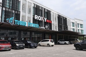 A building with a sign for 'ROXY HOTEL' and 'TURBO FITNESS LITE' on the facade. - Roxy Hotel Aiman (Kota Samarahan)