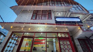 A hotel named "Hotel Jubilant Regency" with a signboard, reception area, and a view of the interior. - Hotel Jubilant Manali (Manali)