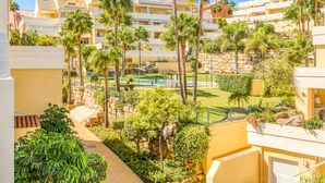 A resort with multiple-story buildings, a swimming pool, and lush greenery. - Bright 2-Bed Apartment in Estepona's Peaceful Puerto Alto with Pools and Terrace (Estepona)