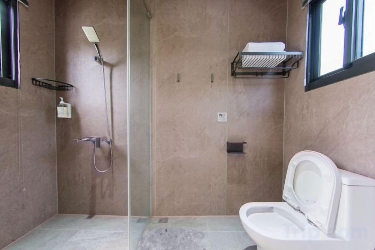 Bathroom | Shower, rainfall showerhead, hair dryer, towels