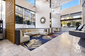 Relax in our spacious lobby with a seating area, reception desk, and stunning views.