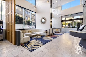 Relax in our spacious lobby with a seating area, reception desk, and stunning views.