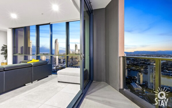 Enjoy a panoramic city view from the spacious room's large window.