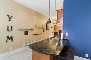 Kitchen breakfast bar with pendant lighting