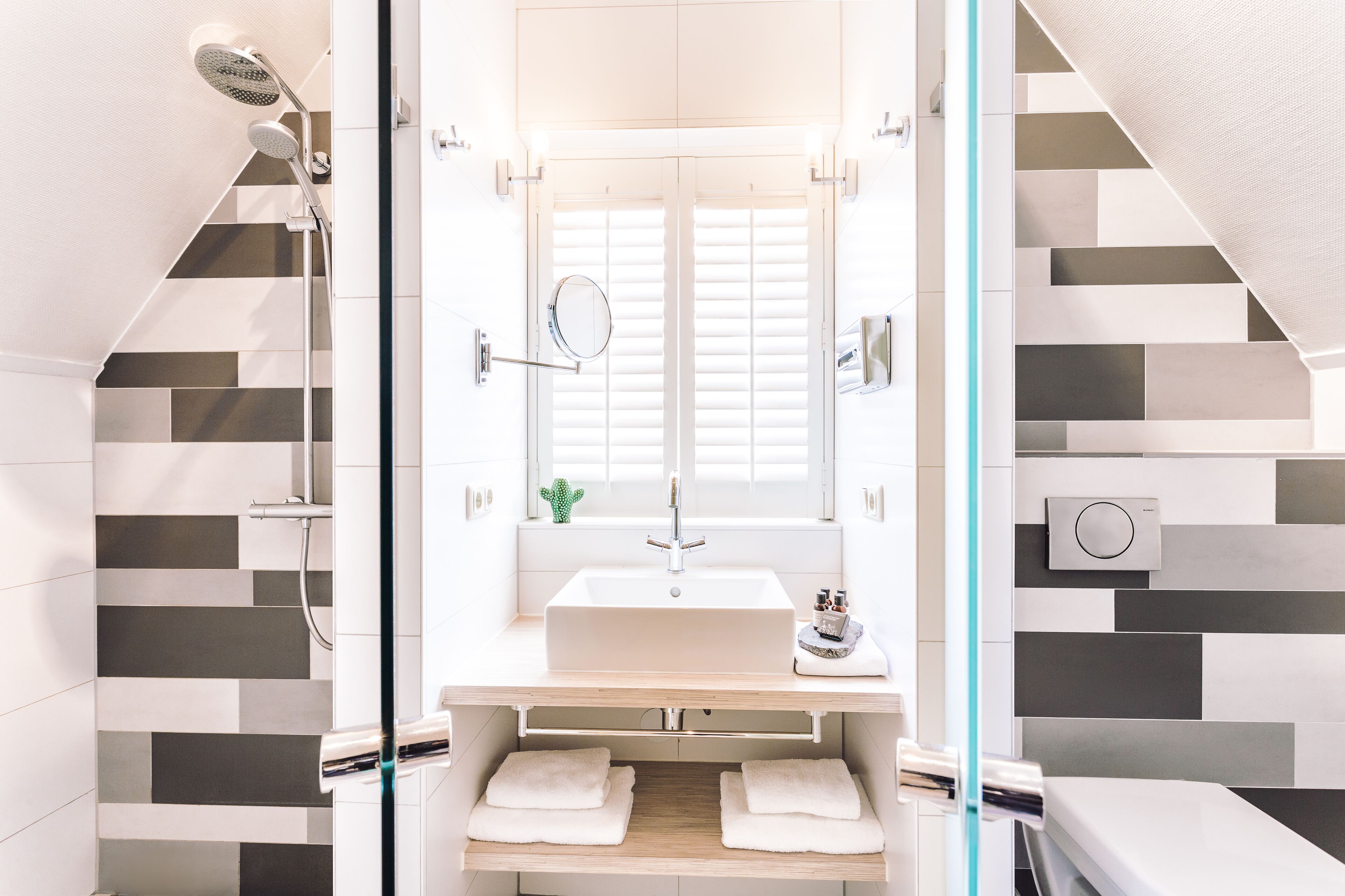 Designer toiletries, hair dryer, bathrobes, towels