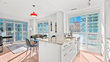 Deluxe Suite, Multiple Beds, Balcony | Private kitchen
