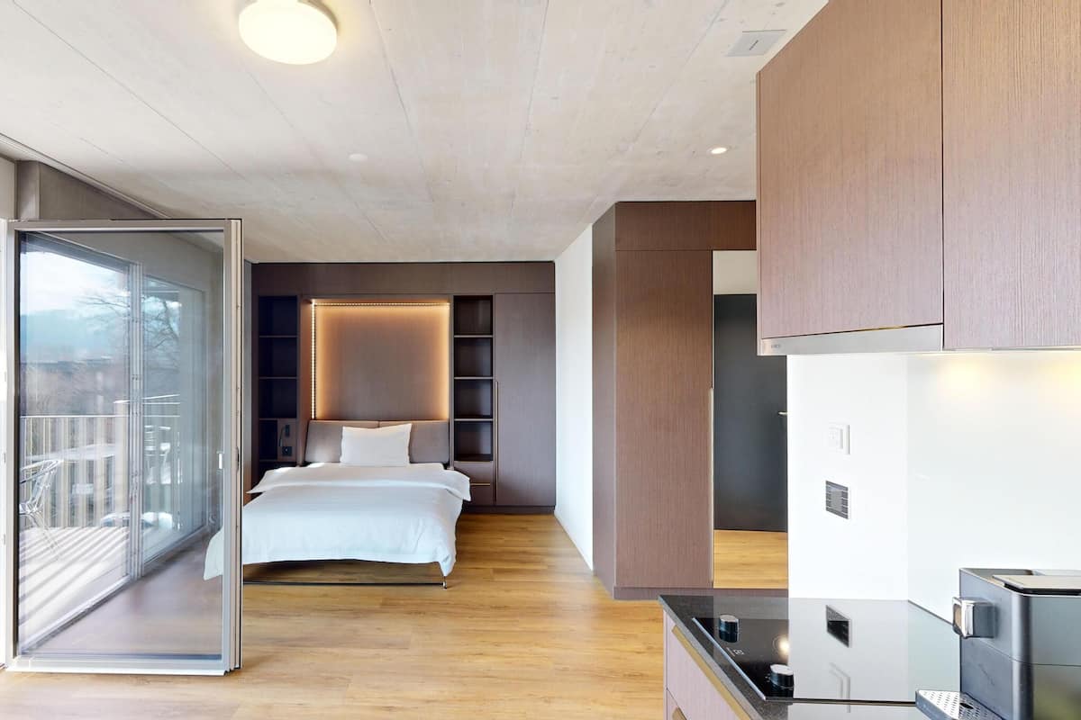 Premium bedding, desk, laptop workspace, soundproofing