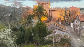 A historic castle with a prominent tower, surrounded by trees and traditional buildings. - Stunning apartment in Vimianzo with WiFi (Vimianzo)