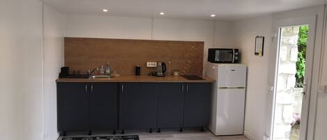Fridge, microwave, stovetop, coffee/tea maker