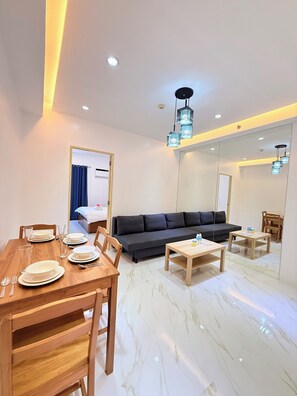 Superior Apartment | Living area | 55-inch TV with digital channels