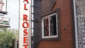 A building with a sign that reads "ROYAL ROSETTE." - Hotel Royal Rosette (New Delhi)