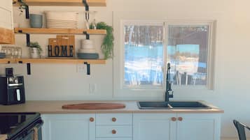 Stovetop, paper towels, dining tables