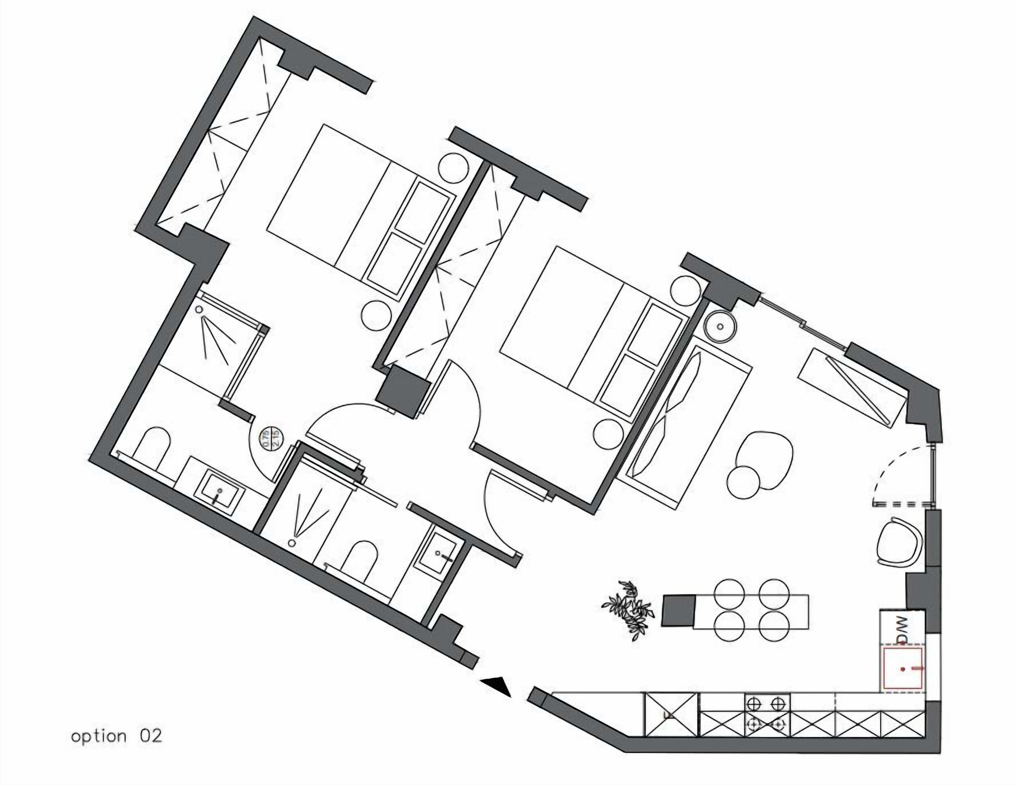 A floor plan of a hotel room with a bathroom, a living area, a dining area, and a kitchen.