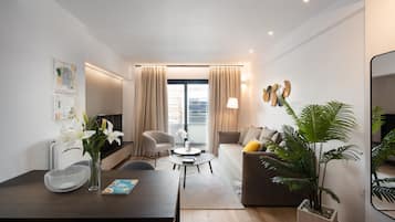 Deluxe Apartment (EDGE - C2) | Living area | 43-inch TV with cable channels