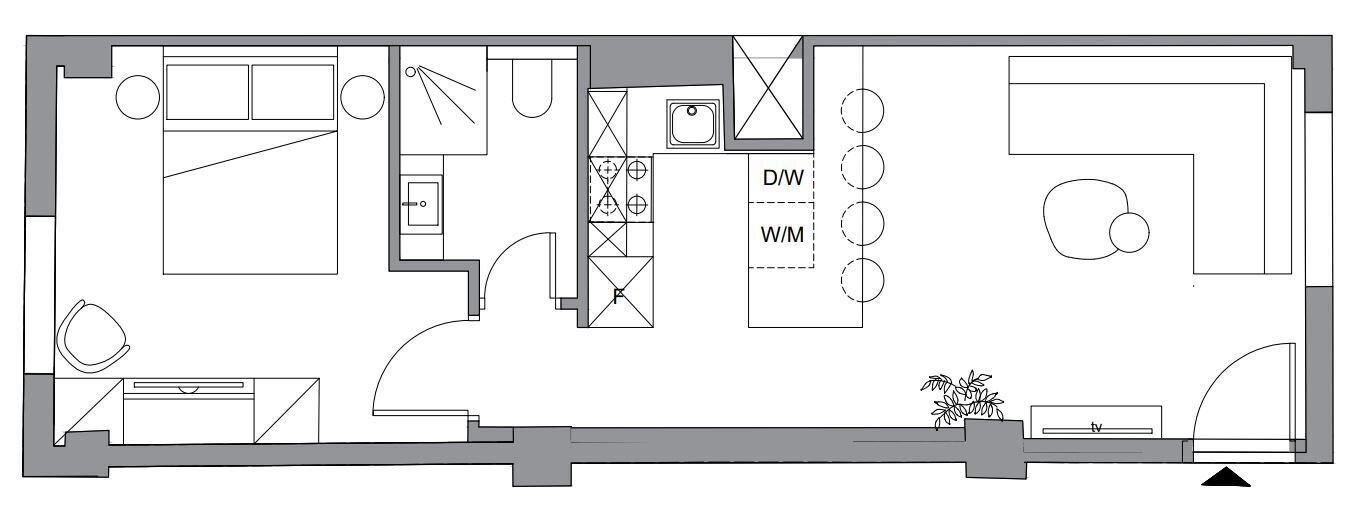 A floor plan with a kitchen, dining area, and a TV in the living room.