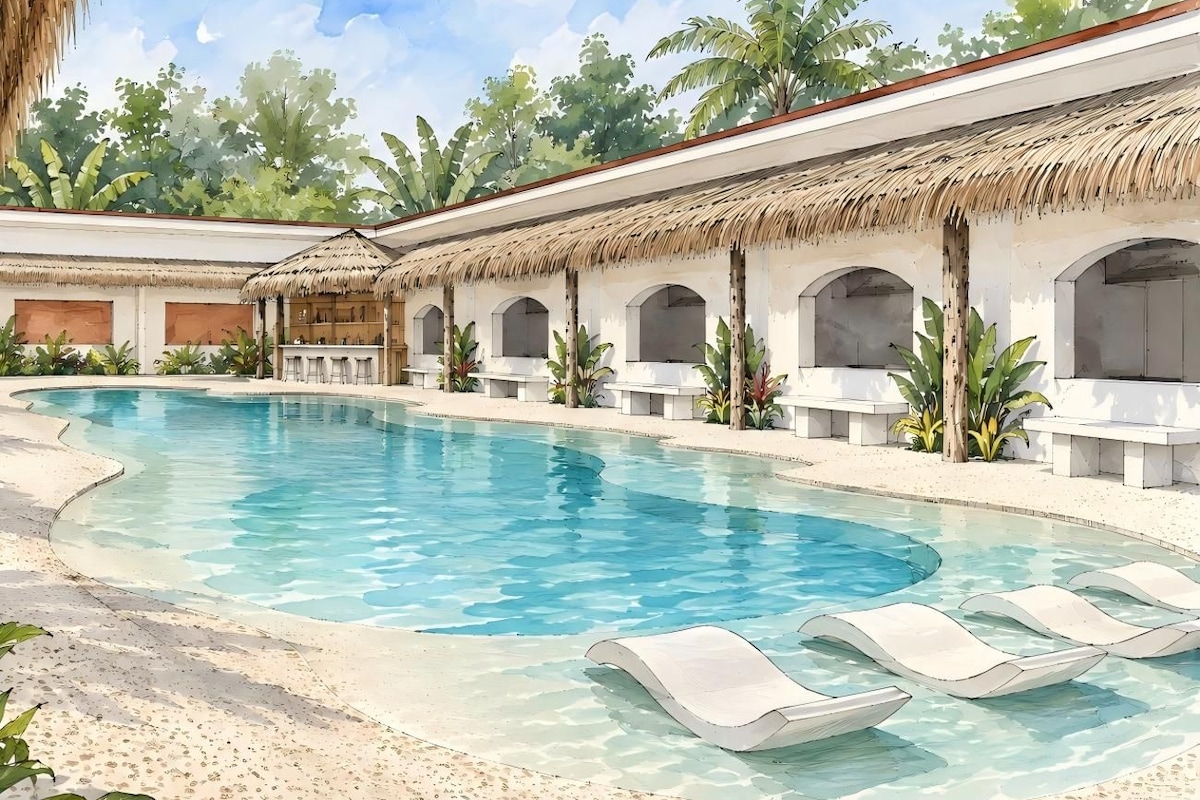 Une piscine avec des chaises longues, un bâtiment à toit de chaume et une végétation tropicale.