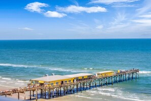 On the beach, sun-loungers, beach towels - Luxury Oceanfront Condo with Gorgeous Views in Daytona Beach Shores.  4BR, 3BA (Daytona Beach)
