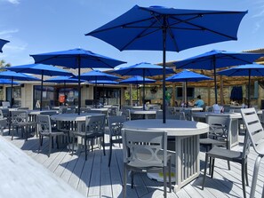 Enjoy dining al fresco on the deck, surrounded by lush views.