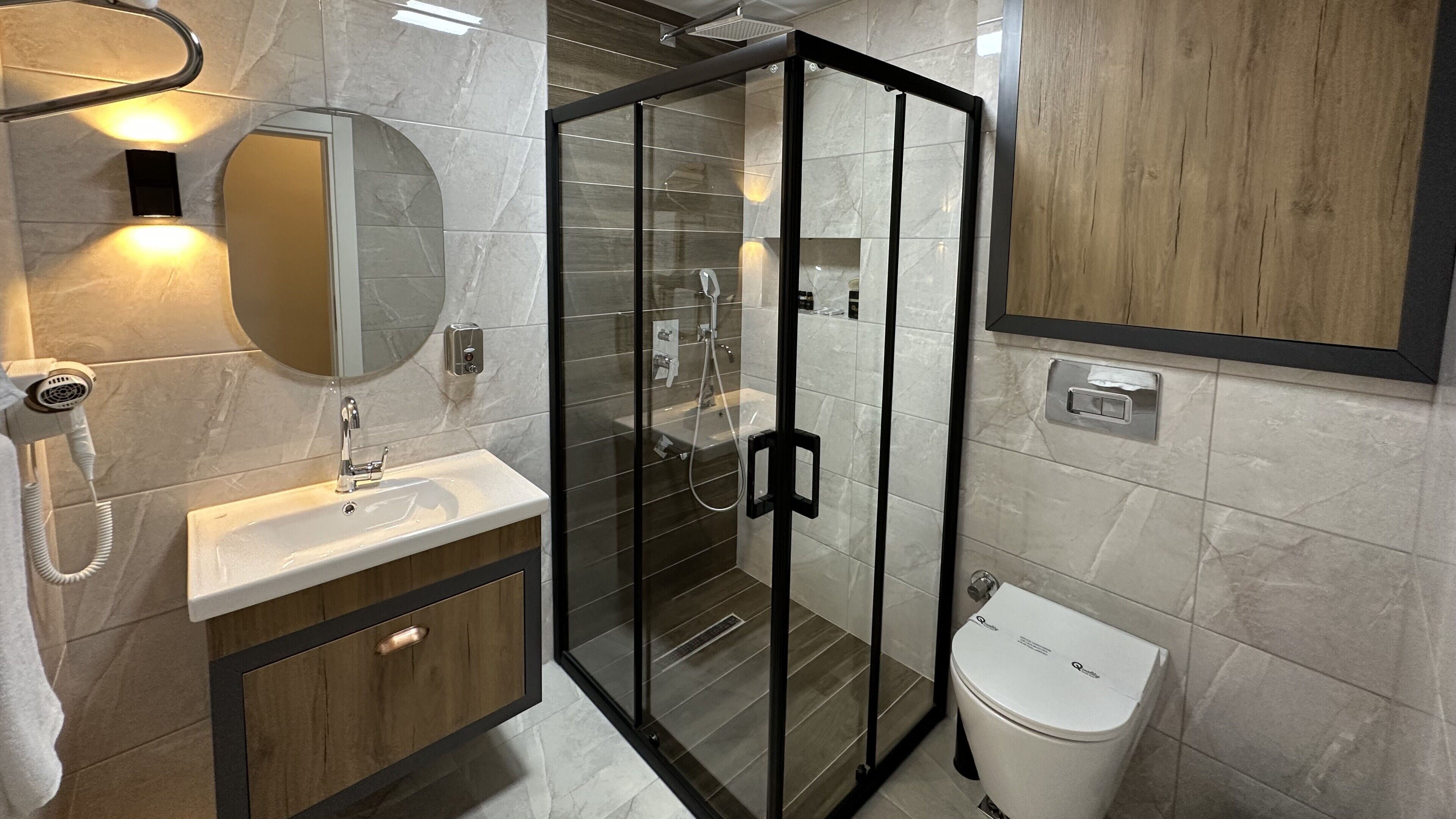 junior suite, multiple beds | bathroom | shower, free toiletries, hair dryer, slippers