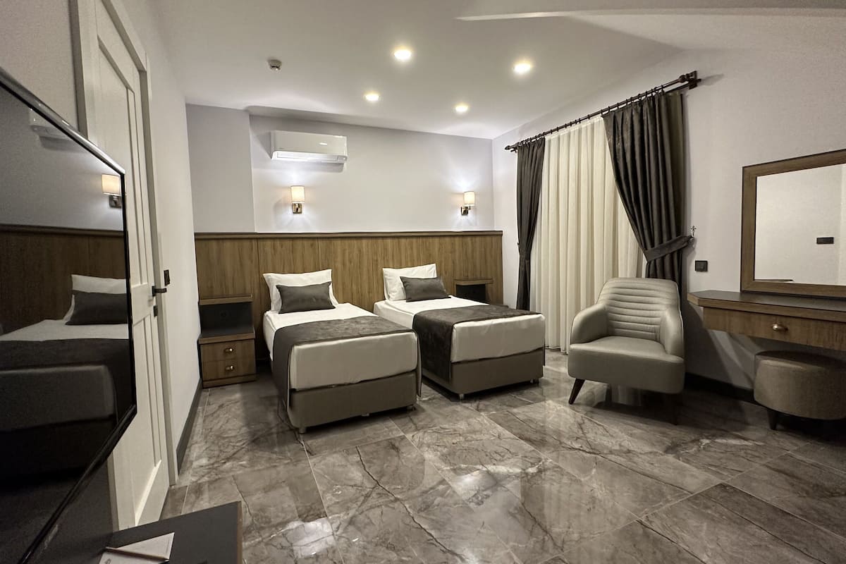 junior suite, multiple beds | 1 bedroom, free minibar items, in-room safe, desk