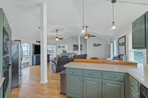 Enjoy cooking in the well-equipped kitchen with a central island and ample storage.