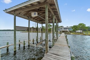 Guests can walk along the pier to a covered area with a roof.