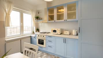 Panoramic Apartment | Private kitchen | Full-sized fridge, microwave, oven, coffee/tea maker