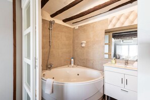 Jetted bath, hair dryer, towels, soap