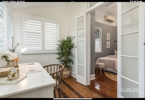 Relax in this inviting living space with a comfortable seating area and cozy bed.