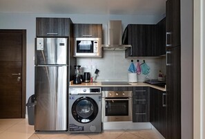 Luxury Apartment, 1 Bedroom, Balcony | Private kitchen | Fridge, microwave, oven, stovetop