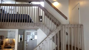 A multi-level interior with a staircase connecting different floors. - Loft in Yosemite National Park (Yosemite West)