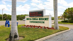 A sign for Boca Ciega Resort Condominium with a rental info display. - Best Views in St Pete for Dolphin Viewing (St. Petersburg)