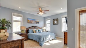 A bedroom with a bed, nightstands, a ceiling fan, and a window with blinds. - Breathtaking Santa Rosa Beach Home < 1 Mi to Gulf! (Santa Rosa Beach)