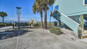 A beachfront property with a sign indicating 27th Ave, a lifeguard tower, and a no parking sign. - Cozy Indian Rocks Beach Condo - Steps to Beach! (Indian Rocks Beach)