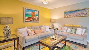A living room with two sofas, a coffee table, and a lamp. - Pet-friendly Fort Myers Home w/ Patio & Grill! (North Fort Myers)
