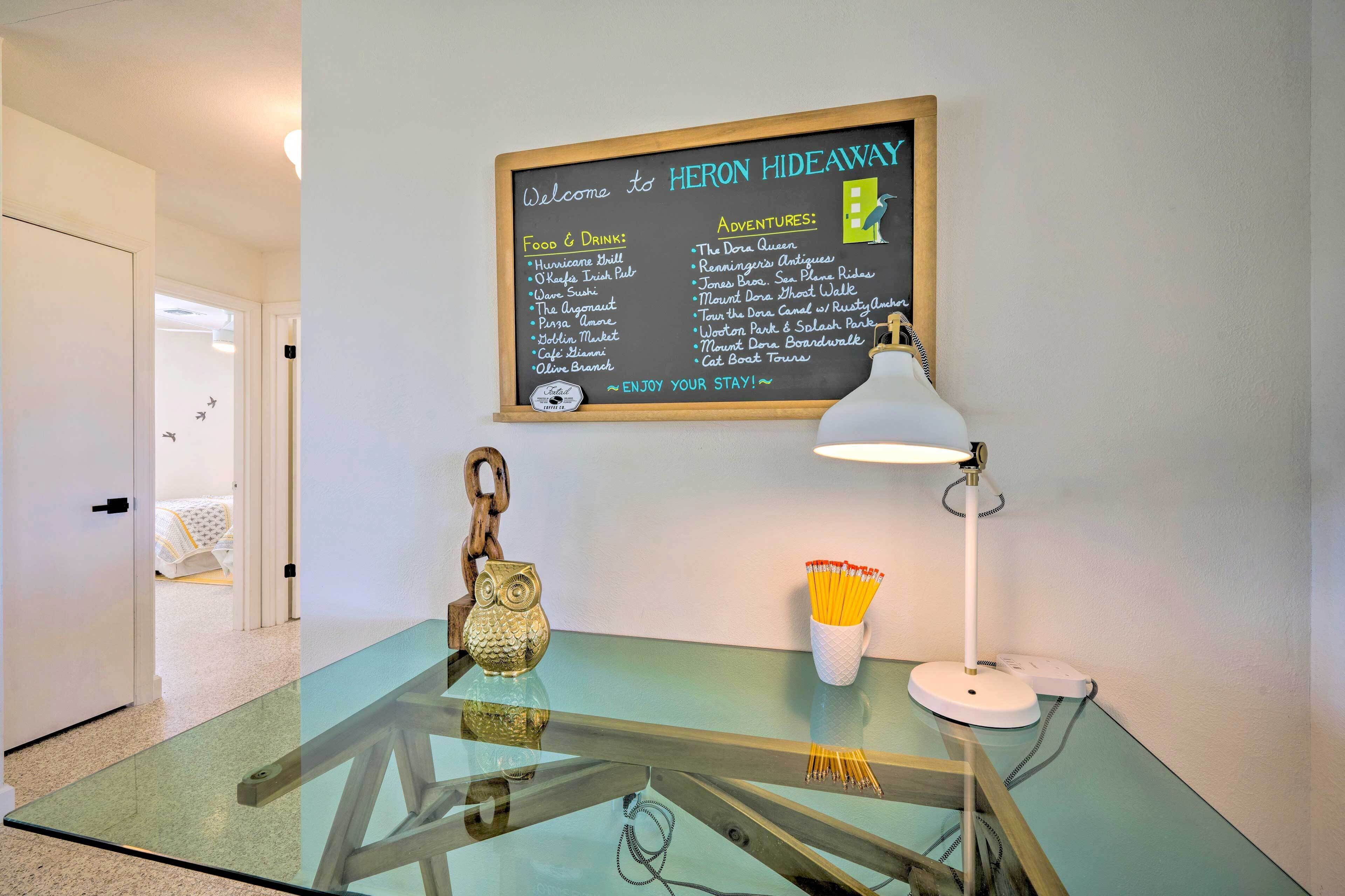 A glass table with a chalkboard menu listing food and drink options, and adventure activities.