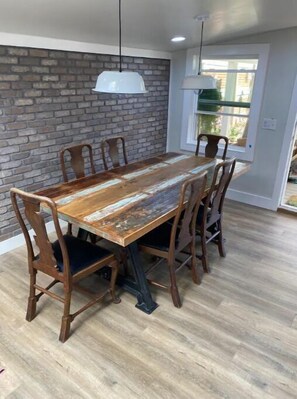 Enjoy meals in this dining area with a long table and six comfortable chairs.