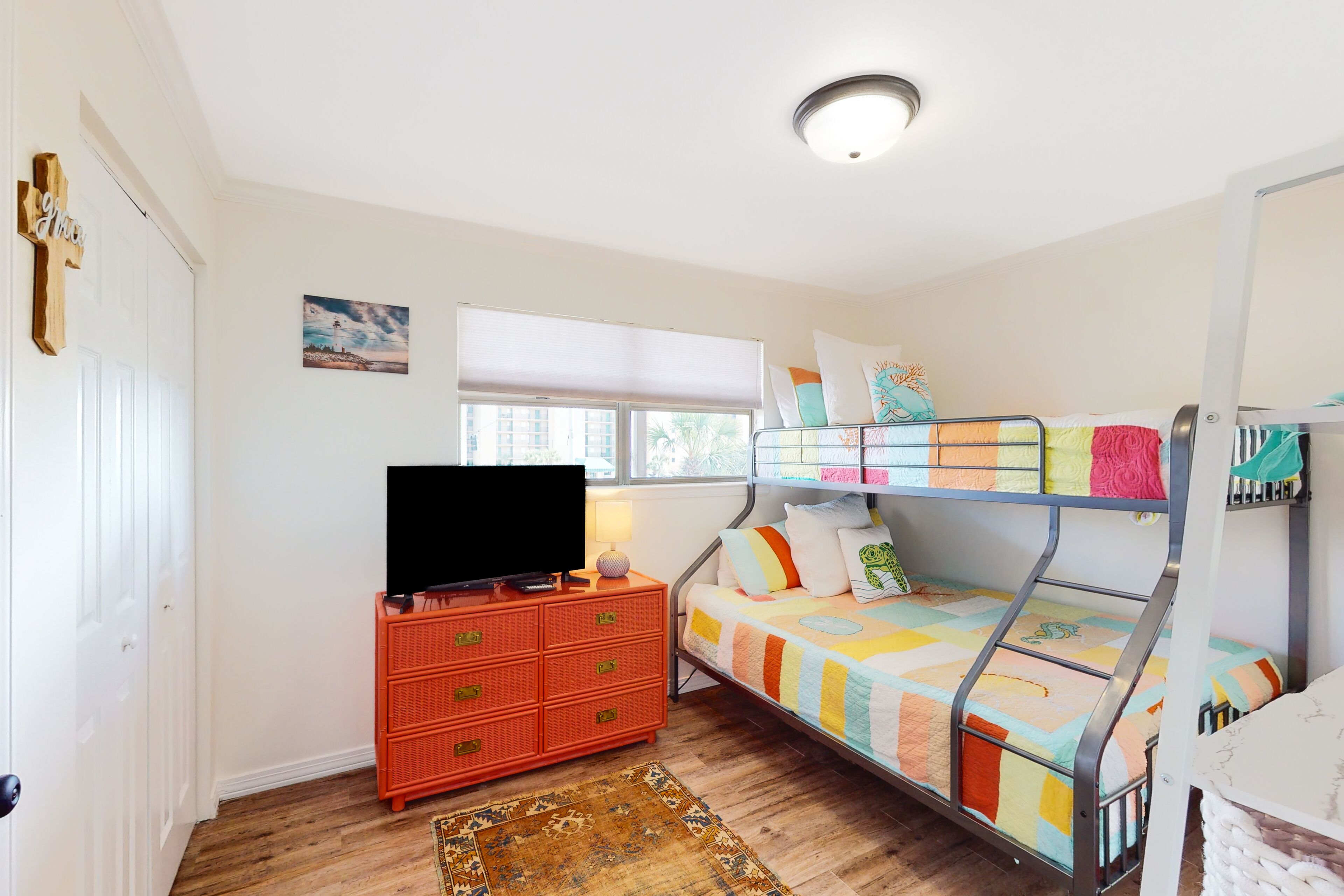 Riverside condo with pool, tennis, covered balcony, & easy beach access