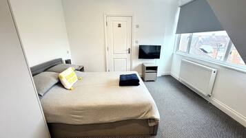 1 bedroom, desk, iron/ironing board, travel crib