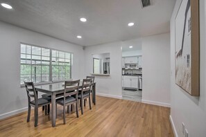 A modern kitchen with white cabinets and a stainless steel refrigerator. - Family-friendly Ocala Retreat: 18 Mi to Dtwn! (Ocala)