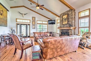 House (3 Bedrooms) | Living area | TV, fireplace, books